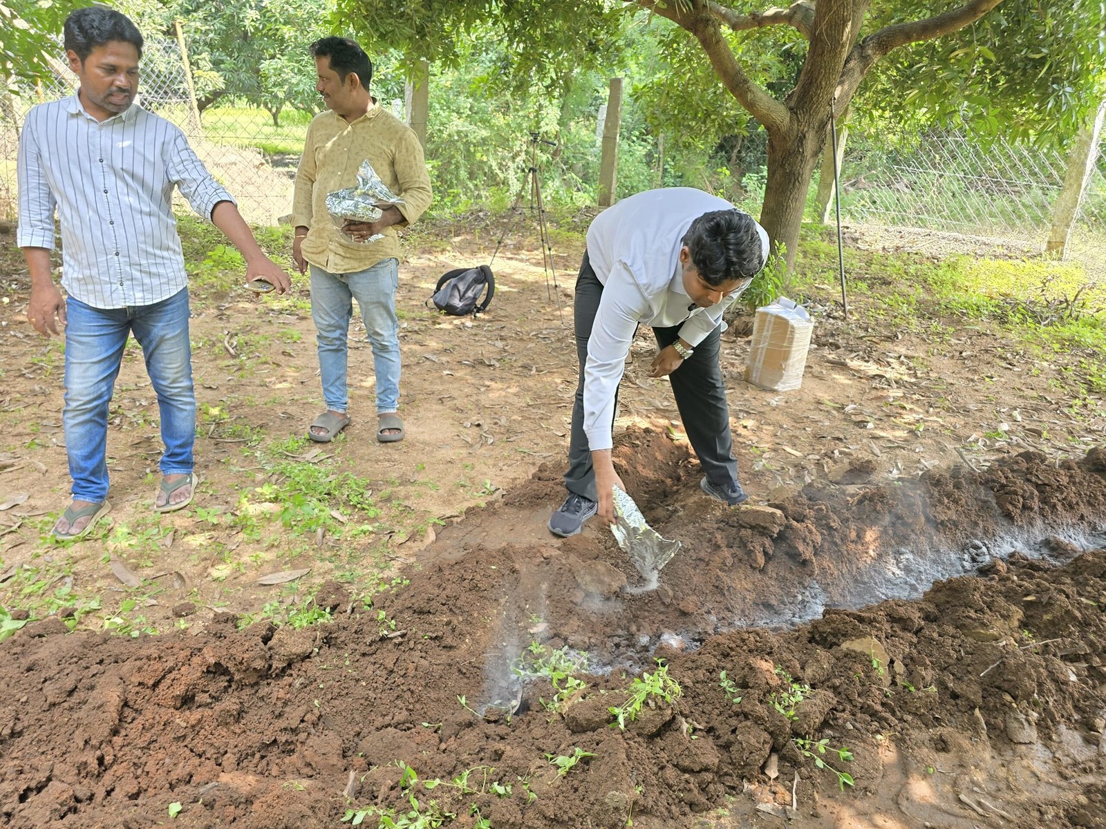 Mr. Suraj Kiran, showing farmers to apply Alka Plus.